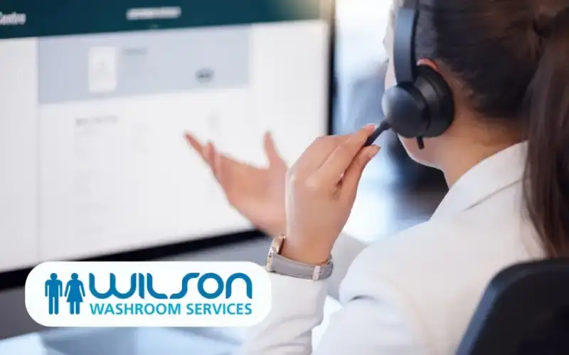 Important Announcement Regarding GOJO Products at Wilson Washrooms, May 2024 1 customer care team member on headset - wilson washrooms gojo administration support